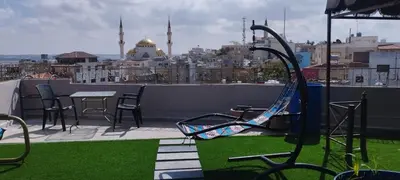 a balcony with a view of a city at Moab Land Hotel in Madaba