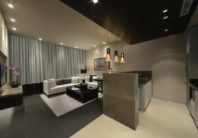 a living room with a couch and a table at The Abdali Boulevard Hotel in Amman
