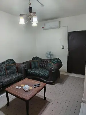 a living room with two couches and a coffee table at الشقة العائلية الحديثة familial new flat in Amman