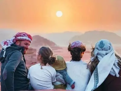 a group of people standing on top of a mountain at Wadi Rum Desert Tours and Glamping with Hussein in Wadi Rum