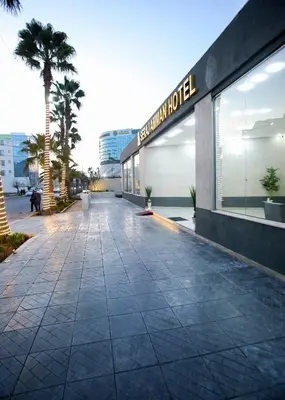 an empty sidewalk in front of a building at Seraj Amman Hotel in Amman