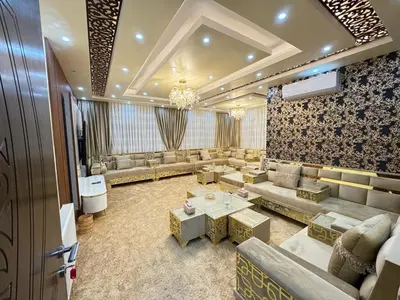 a large living room with couches and a table at شقق فندقية فاخرة in Amman