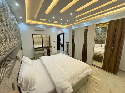 a bedroom with a large bed in a room at شقق فندقية فاخرة in Amman
