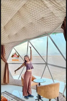 a woman standing in a room with her arms in the air at Abdul Rahman Wadi Rum in Wadi Rum