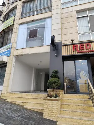 a facade of a building with a sign on it at Gentle Breeze Studio 3 in Amman