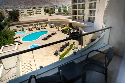 a view of a pool from the balcony of a hotel at Oryx Hotel Aqaba in Aqaba