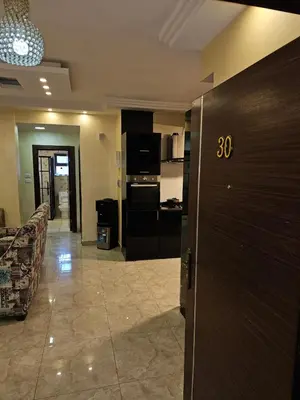 a room with a kitchen and a living room at Apartment no 30 in Amman