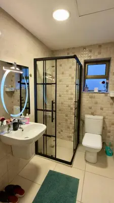a bathroom with a toilet and a sink and a shower at Apartment no 30 in Amman