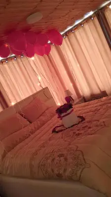 a bedroom with a bed with a canopy and lights at Heritige Inn Jordan in Ad Dimnah