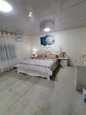 a bedroom with a large white bed in a room at Heritige Inn Jordan in Ad Dimnah