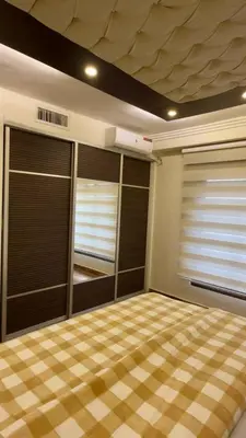 a room with two closets with blinds on them at 2bd apartment 32 in Amman