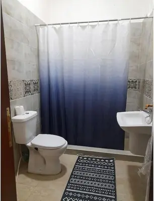 a bathroom with a toilet and a sink at 3bedrooms apt near paris square in Amman