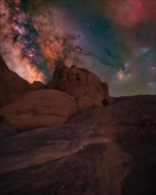 a painting of a desert under a night sky at Wadi Rum Magic Stars in Wadi Rum
