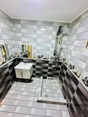 a bathroom with a sink and a mirror at Margaret from Petra cave house in Wadi Musa