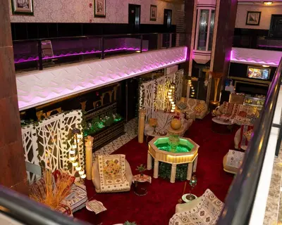 an overhead view of a restaurant with tables and chairs at Sama Paris Plaza Hotel in Amman