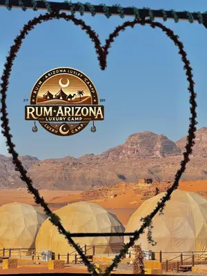 two domes in the desert with a sign that reads run african nomari at RUM ARIZONA lUXURY CAMP in Wadi Rum