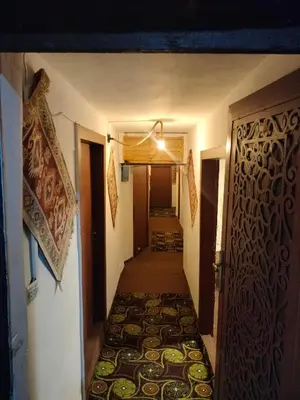 a hallway leading to a room with a door at Dana Village Lodge in Dana