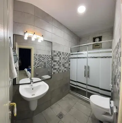 a bathroom with a sink and a toilet at Petra Heaven Boutique in Wadi Musa