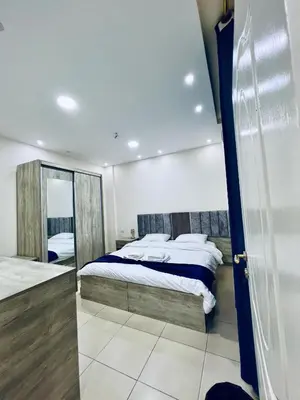 a bedroom with a bed and a mirror at Petra Heaven Boutique in Wadi Musa