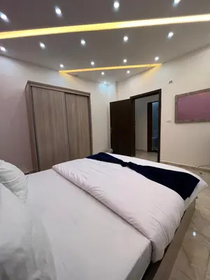 a bedroom with a large white bed in a room at Petra Heaven Boutique in Wadi Musa