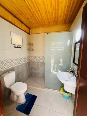 a bathroom with a toilet and a sink at marram apartment in Aqaba