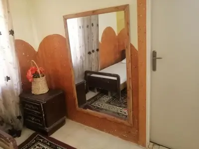 a mirror in a room with a sink and a stove at Dana star in Dana