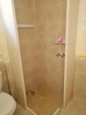 a bathroom with a shower with a toilet at Dana star in Dana