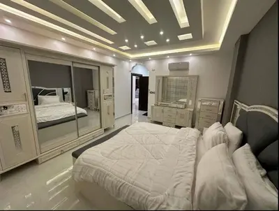 a bedroom with a large bed in a room at شقق فندقية فاخرة in Amman