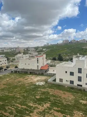 an aerial view of a city with buildings at شقة مفروشة in Rujm Maghghijhah