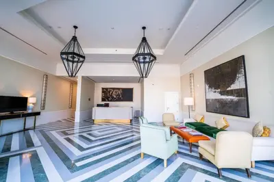 a living room with a couch and chairs at Boulevard, Abdali Luxury 1 BR Apartment in Amman