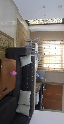 a room with a bed with pillows and a window at Golden hotel in Jerash