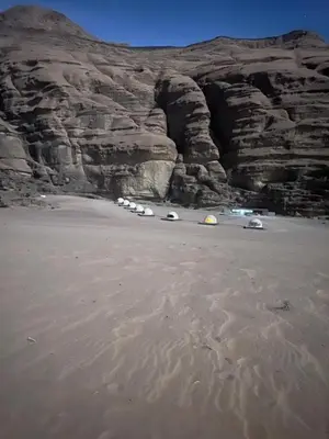 a group of cars parked in front of a mountain at 7stars in Disah