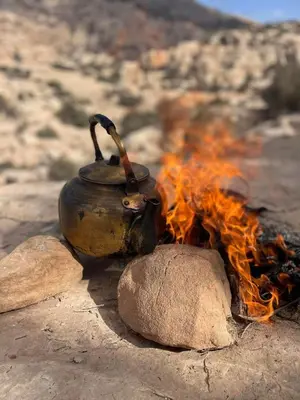 a pot sitting on top of a camp fire at family home Lodge in Dana