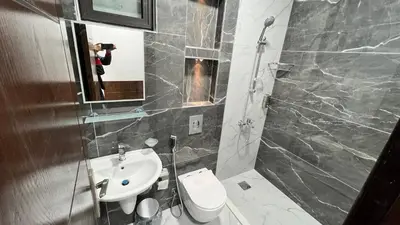 a bathroom with a sink and a toilet and a mirror at شقق عمو سامي بغرفتين نوم 2 in Amman