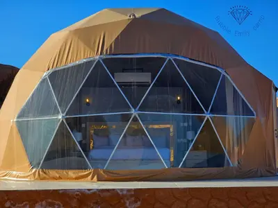 a large dome tent with a glass wall at Bubble Emily camp in Wadi Rum