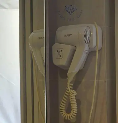 a hairdryer and a hair dryer in a box at Bubble Emily camp in Wadi Rum