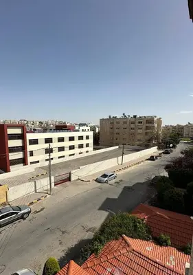 a view of a city street with cars on the road at Tlaa al ali amman 3 rooms furnished apartment المحكمة الدستورية in Umm Uthainah