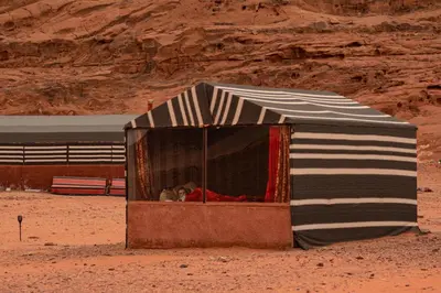 a small tent in the middle of the desert at Wadirum sunset camp in Wadi Rum