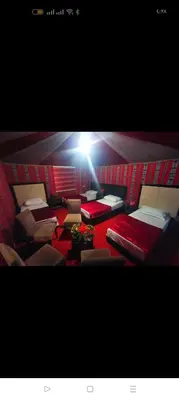 a room with a bunch of beds in it at Rum Honeymoon Camp in Wadi Rum