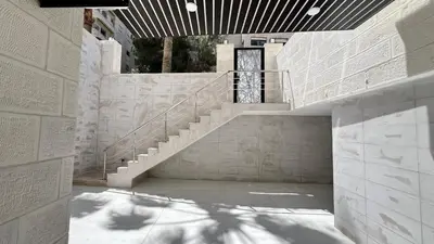 a staircase in a building with a stair case at شقة بثلاث غرف نوم الجاردنز عمو سامي in Amman
