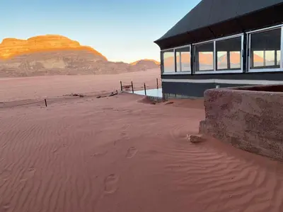 a building in the middle of a desert at Wadi rum stay & tours in Wadi Rum