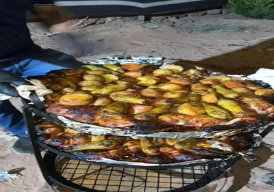 a grill with a bunch of food on it at Wadi rum stay & tours in Wadi Rum