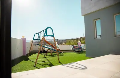 a playground on the balcony of a house at Gerasa Breeze resort in Rujm al Miḑmār