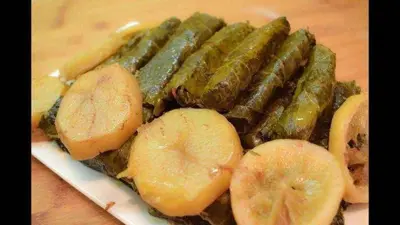 a plate of food with bananas and pickles at Samira House in Amman