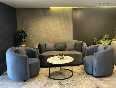 a living room with two chairs and a couch at Saraya Abdeen Hotel in Aqaba