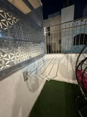 a view from the top of a balcony of a building at Stylish Luxe Apartment F/R 0001 in Amman