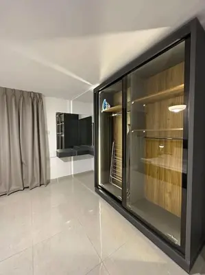 a living room with a large window in a room at Stylish Luxe Apartment F/R 0004 in Amman