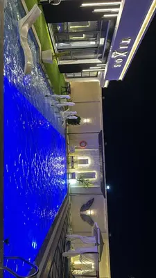 a large aquarium with a fish in the water at Tixos Farm in Irbid