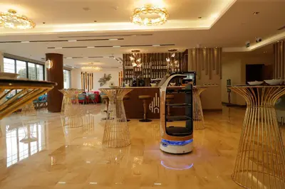 a barber shop with a cell phone in a room at Soho Midtown in Ash Shumaysānī