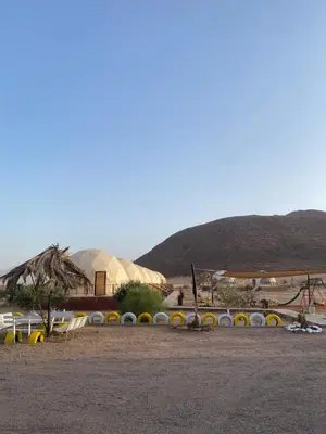 a park with a playground and a play structure at Omar Camp Wadi Rum in Disah